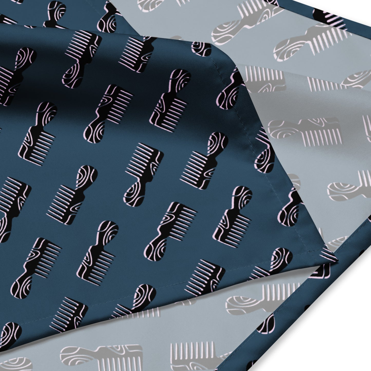 Two-tone Mini Afro Combs All-Over Print Bandana featuring repeating comb patterns on dark and light fabric layers, designed for melanin-rich fashion and purpose-driven style.