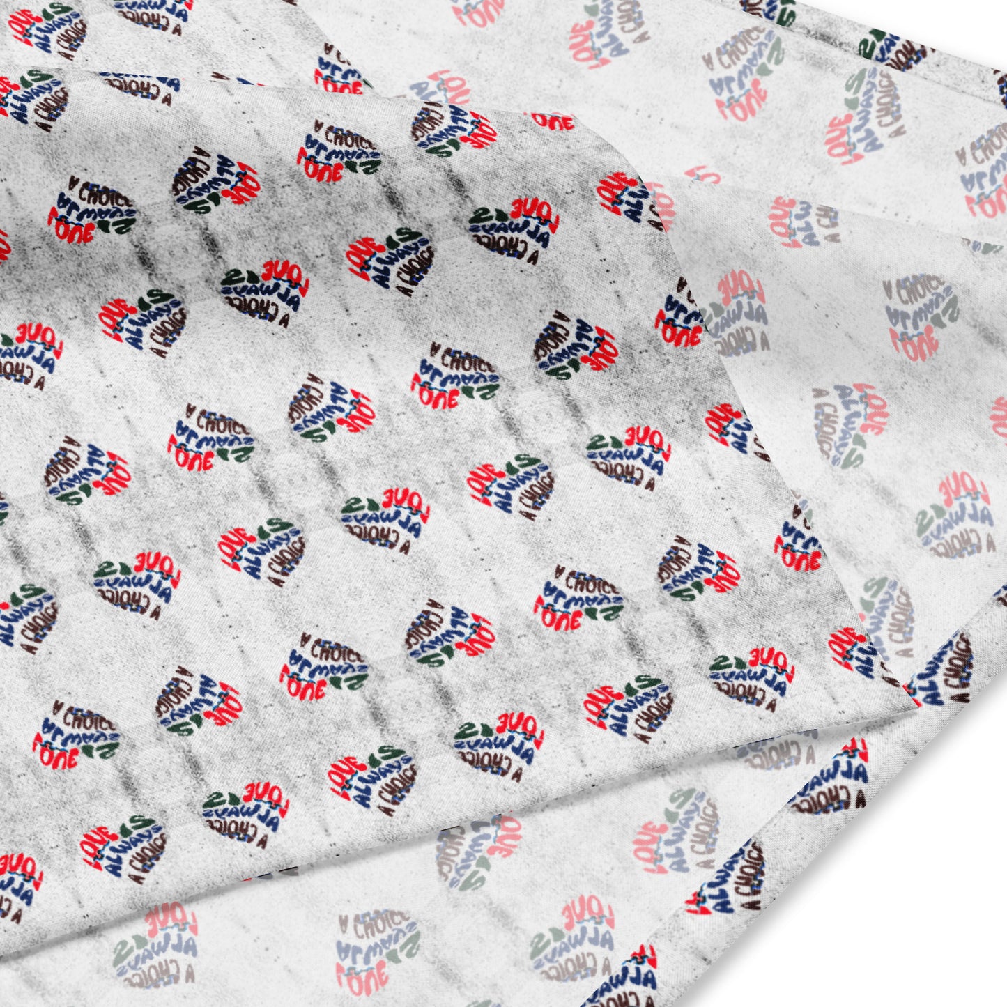 White bandana featuring an all-over print of colorful heart-shaped designs with the phrase Love Is Always A Choice Bandana repeated across the fabric.