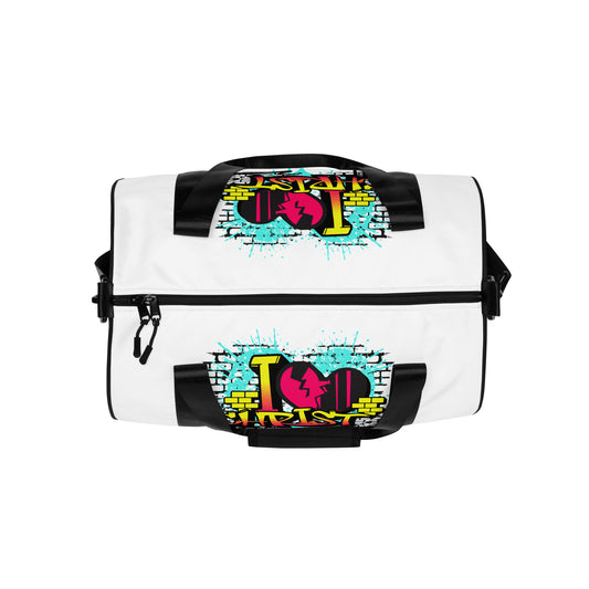 White gym bag with black straps featuring colorful graffiti-style "I Love Christ" design, blending faith-inspired apparel and purpose-driven messaging, Gym Bag – I Love Christ (Black & White).