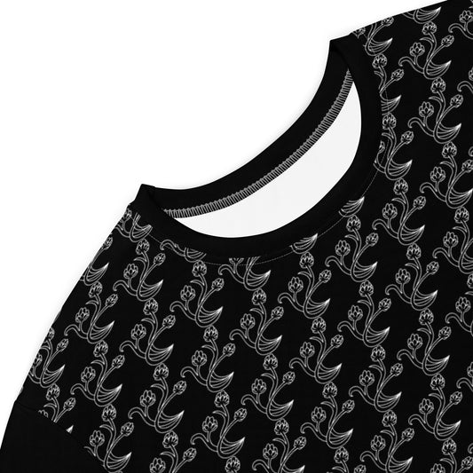 Close-up of the neckline and upper section of the Black & Gray Chain Loop T-Shirt Dress featuring a black fabric with a repeating delicate gray floral chain pattern.