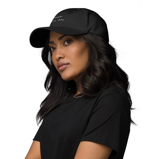 Woman wearing a black Dad Hat – Yahweh Every Day with matching black shirt, showcasing a faith-inspired apparel piece with a subtle and stylish design.