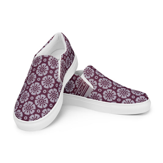 Pair of Women's High Top Sneakers – Floral in Cranberry featuring a slip-on design with a cranberry background and light floral pattern, blending melanin-rich imagery and purpose-driven messaging.