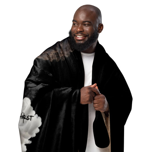 Smiling man wrapped in a black and tan Sherpa Blanket – High on Christ with faith-inspired design, showcasing cozy home decor perfect for inspirational gifts.