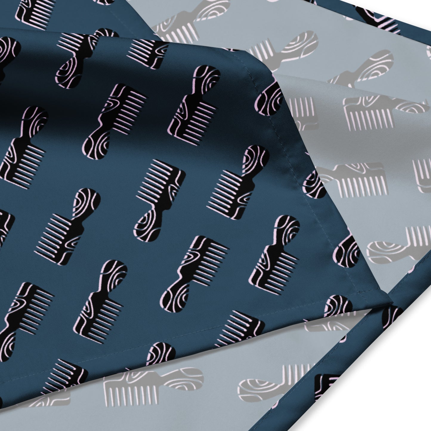Mini Afro Combs All-Over Print Bandana featuring a stylish pattern of mini afro combs on a dark background, showcasing a smooth fabric design ideal for melanin fashion and Black women apparel.