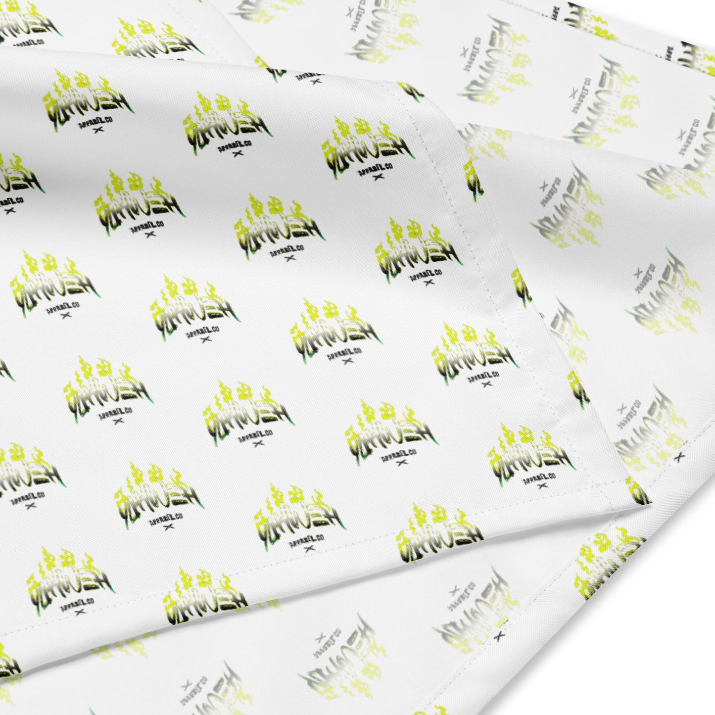White fabric featuring a repeating pattern with vibrant yellow flame designs and the text "Yahweh Apparel Co. Bandana," showcasing faith-inspired print-on-demand apparel.