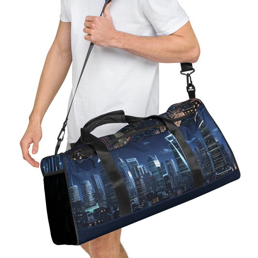 A person wearing a white shirt carrying a Duffle Bag – Night Life featuring a nighttime city skyline print with illuminated skyscrapers and black straps.