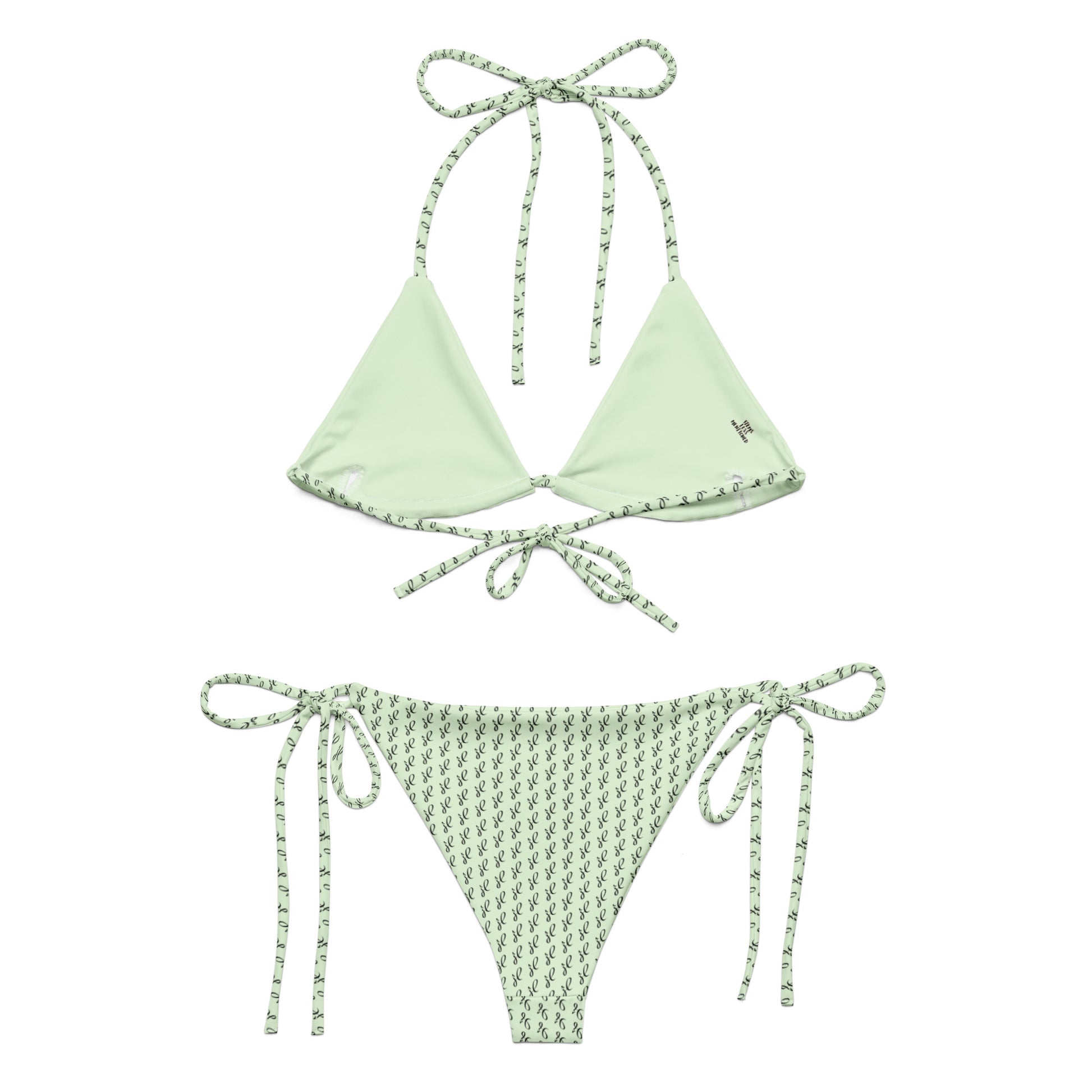 Emerald Script Recycled String Bikini featuring a solid light green triangle top with patterned trim and matching patterned tie-side bottoms made from eco-friendly materials.