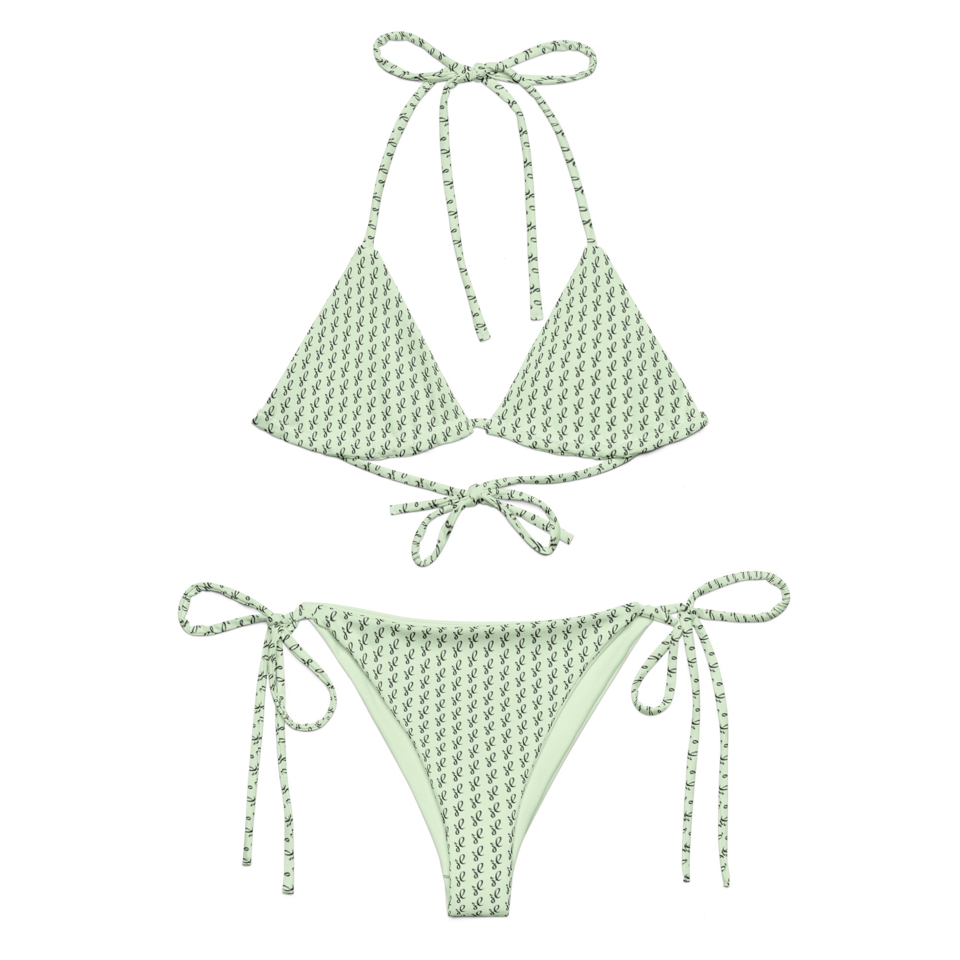 Emerald Script Recycled String Bikini in light green with delicate dark script pattern, featuring adjustable tie straps on top and bottom for a customizable fit.
