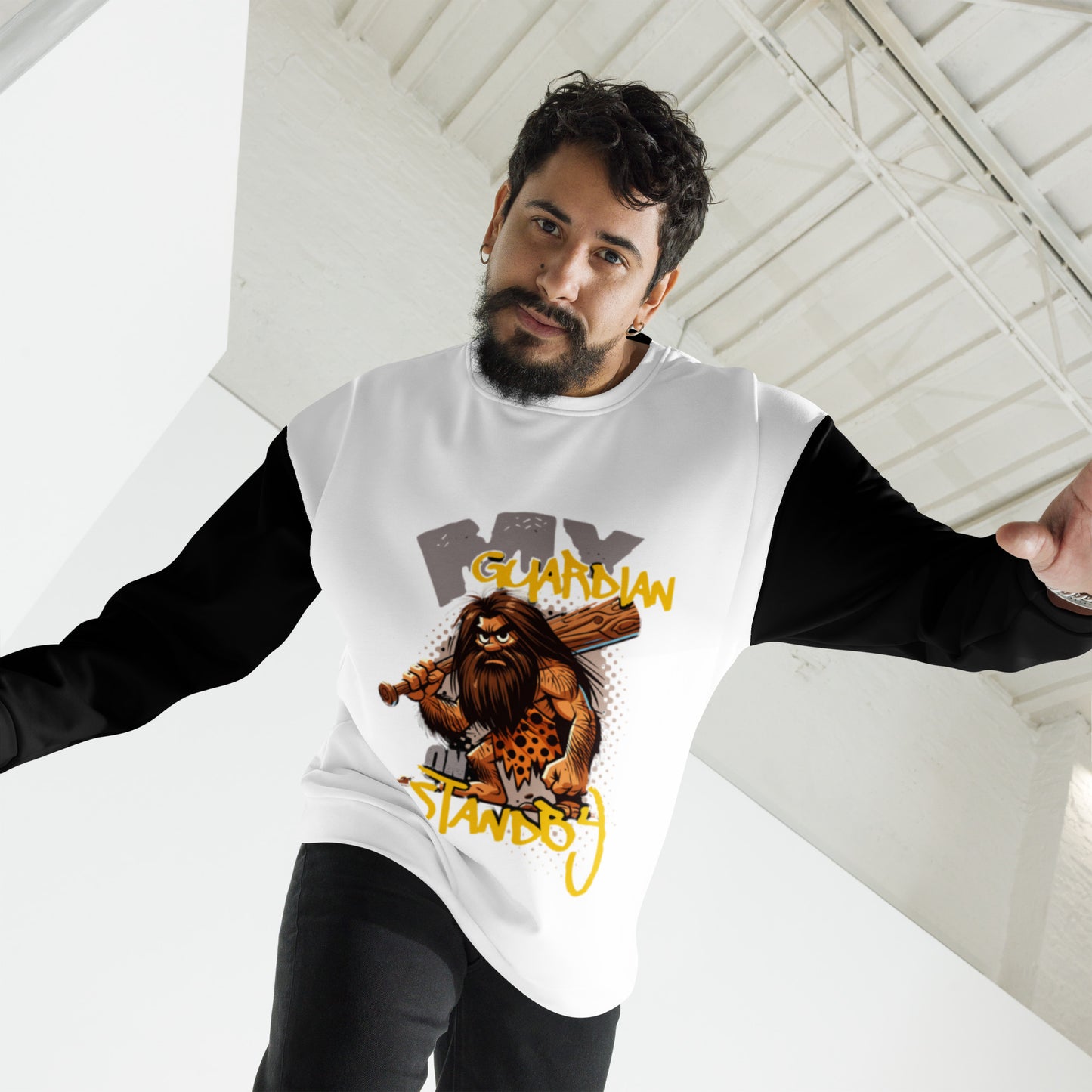 Man wearing a white and black long-sleeve Unisex Sweatshirt – My Guardian Angel on Standby featuring a bold caveman graphic with faith-inspired, purpose-driven messaging.