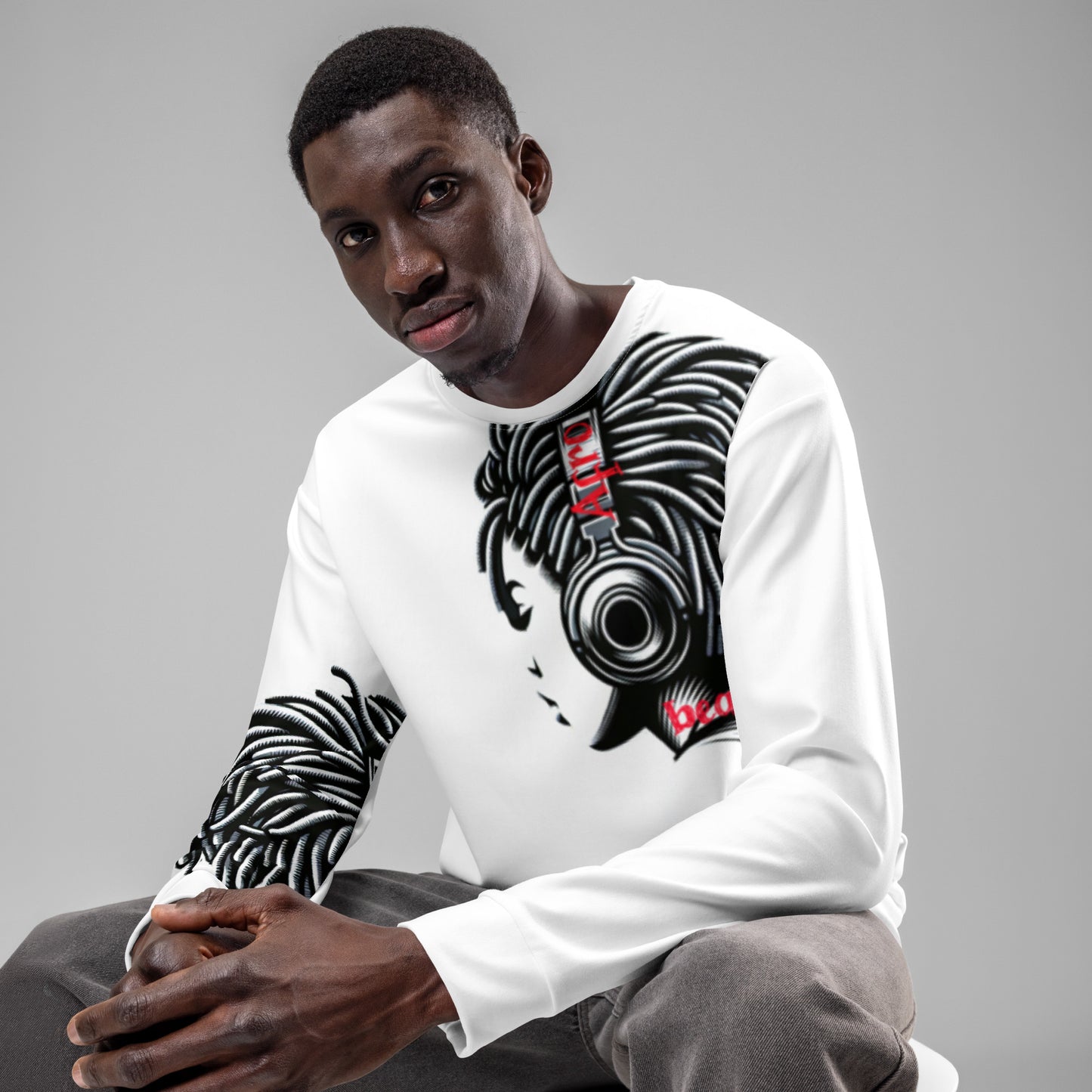 Man wearing a white Unisex Sweatshirt – Afro Vibes featuring bold black and red melanin-rich imagery of a woman with headphones, reflecting faith-inspired apparel with purpose-driven messaging.