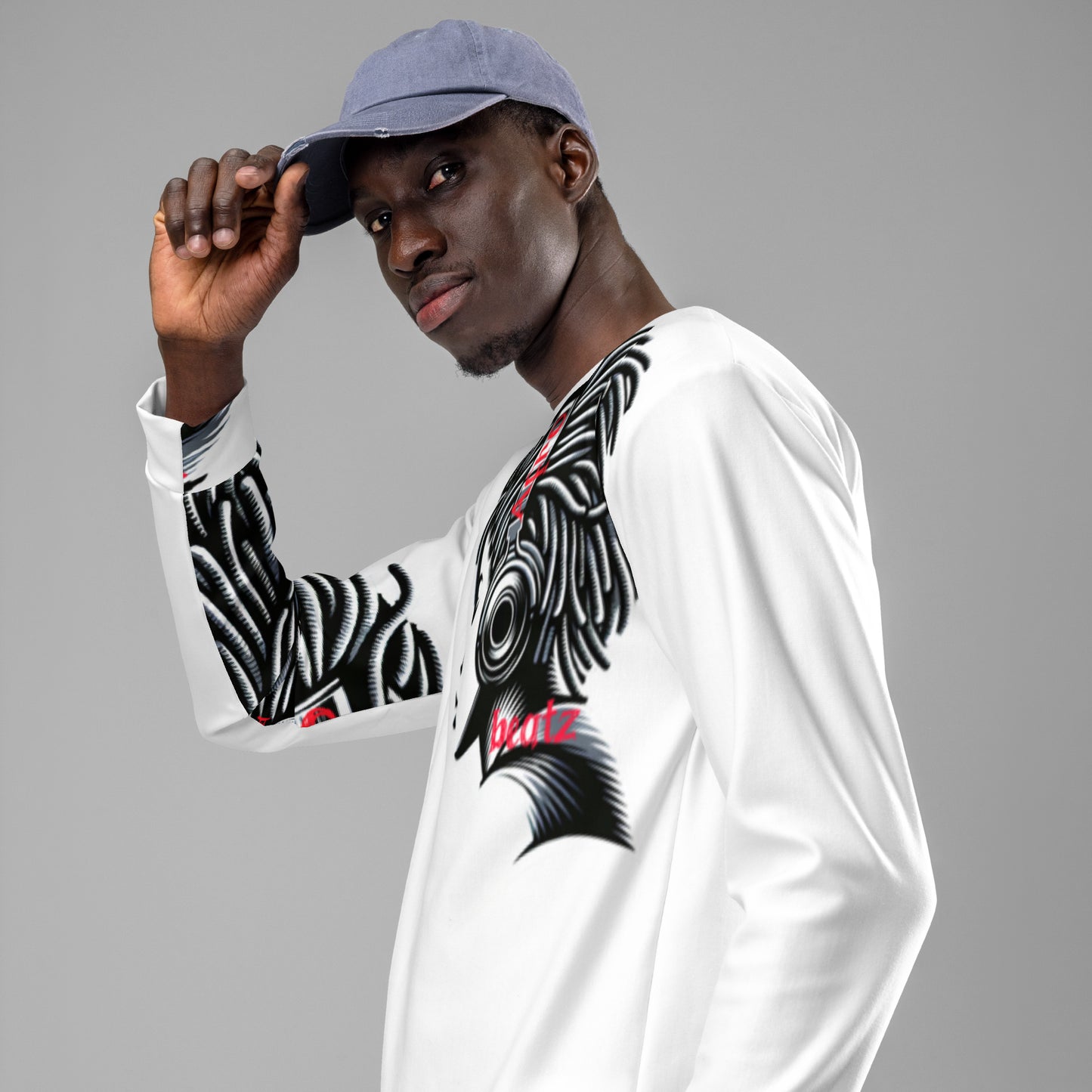 Model wearing a white Unisex Sweatshirt – Afro Vibes featuring bold black and red melanin-rich patterns, paired with a light blue cap, embodying purpose-driven faith-inspired apparel.
