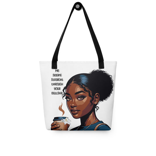 White tote bag with black straps featuring a confident melanin-rich illustration of a woman holding a coffee cup and text reading "Me seeing straight through your bullshit," embodying faith-inspired purpose. Tote Bag – Side Eye Queen.