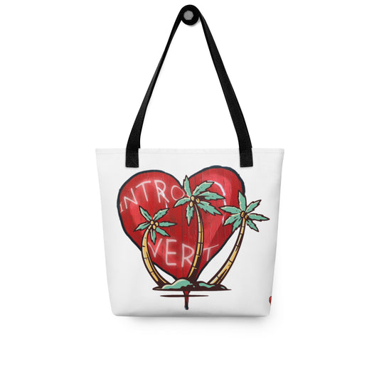 White tote bag with black handles featuring a red heart and three palm trees with the word "Introvert" displayed, Tote Bag – Introvert design.