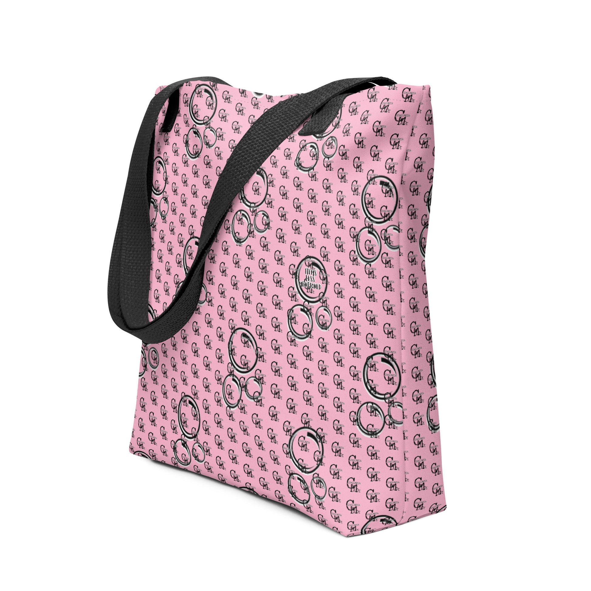 Pink tote bag with black bubble patterns and black handles, designed for everyday use, featuring the product name Bag – Bubbles.