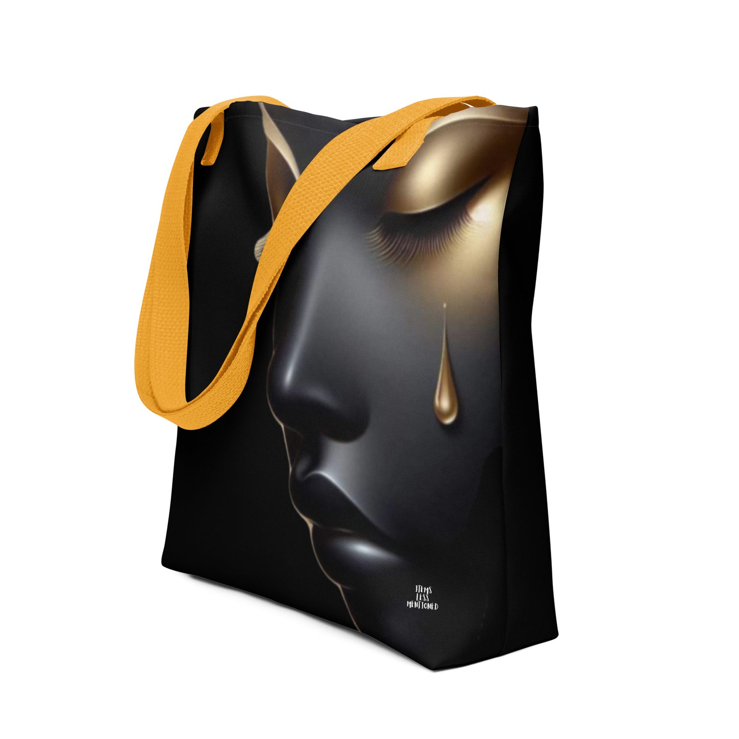 Tote Bag – Still She Rises featuring a striking melanin-rich design of a tearful face with gold accents and yellow straps, blending faith-inspired art with purpose-driven messaging.