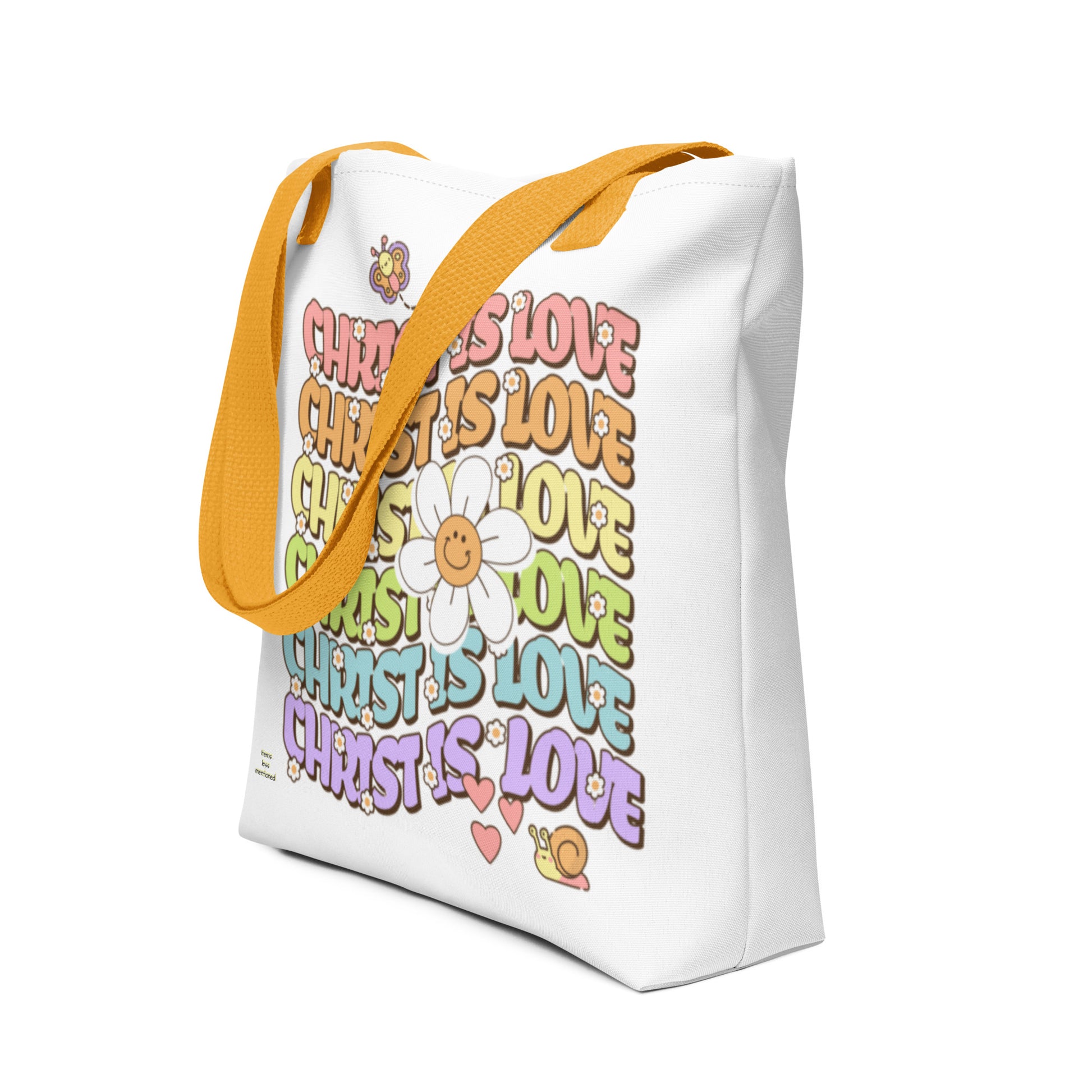 Tote Bag – Christ Is Love featuring colorful repeating text with cheerful daisy, butterfly, and snail illustrations, bright yellow straps, ideal faith tote bag for inspirational gifts.