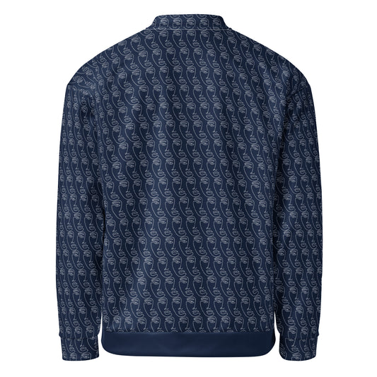 Back view of the Ancestral Faces Unisex Bomber Jacket in navy blue featuring a subtle all-over pattern of stylized ancestral face designs, showcasing unique melanin-rich inspired apparel.