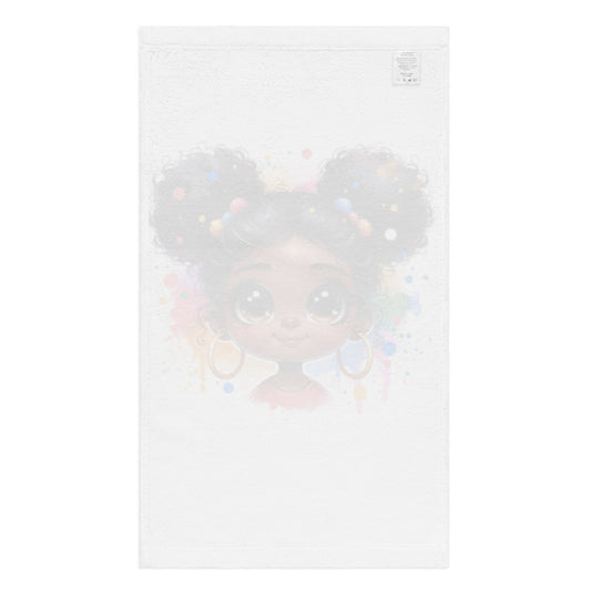White hand towel featuring a cute illustration of a young Black girl with large brown eyes and colorful hair accessories, embodying melanin-rich imagery and faith-inspired artistry in the Hand Towel – Pretty Brown Eyes.