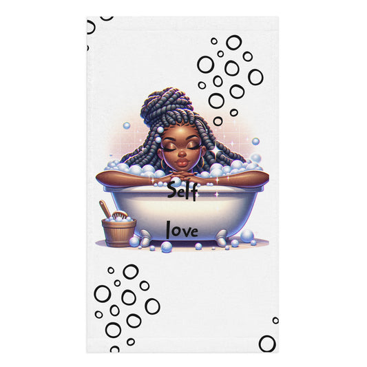 Hand Towel – Self Care featuring a serene illustration of a Black woman with braided hair relaxing in a bubble bath with the words "Self love" and bubbles surrounding her, promoting faith-inspired, purpose-driven messaging.