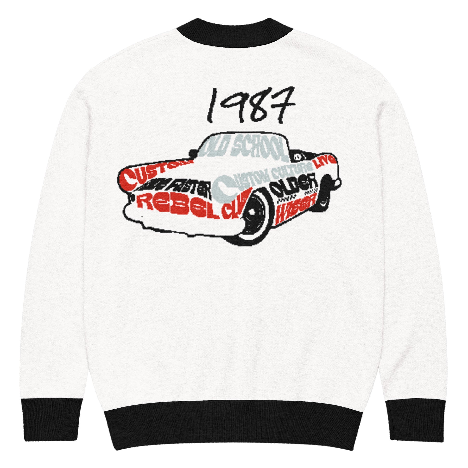 Back view of a Knitted Cardigan – 1987 Rebel featuring a vintage car graphic with bold red and black lettering, blending faith-inspired apparel and purpose-driven messaging.