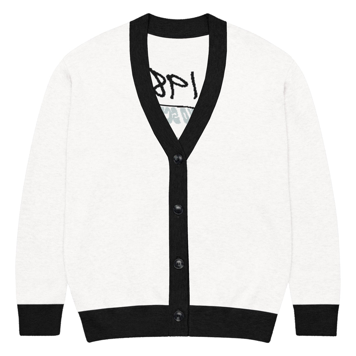 White knitted cardigan with black trim on collar, cuffs, and hem, styled in minimalist design featuring buttons down the front, part of the Knitted Cardigan – 1987 Rebel collection emphasizing faith-inspired apparel and purpose-driven messaging.