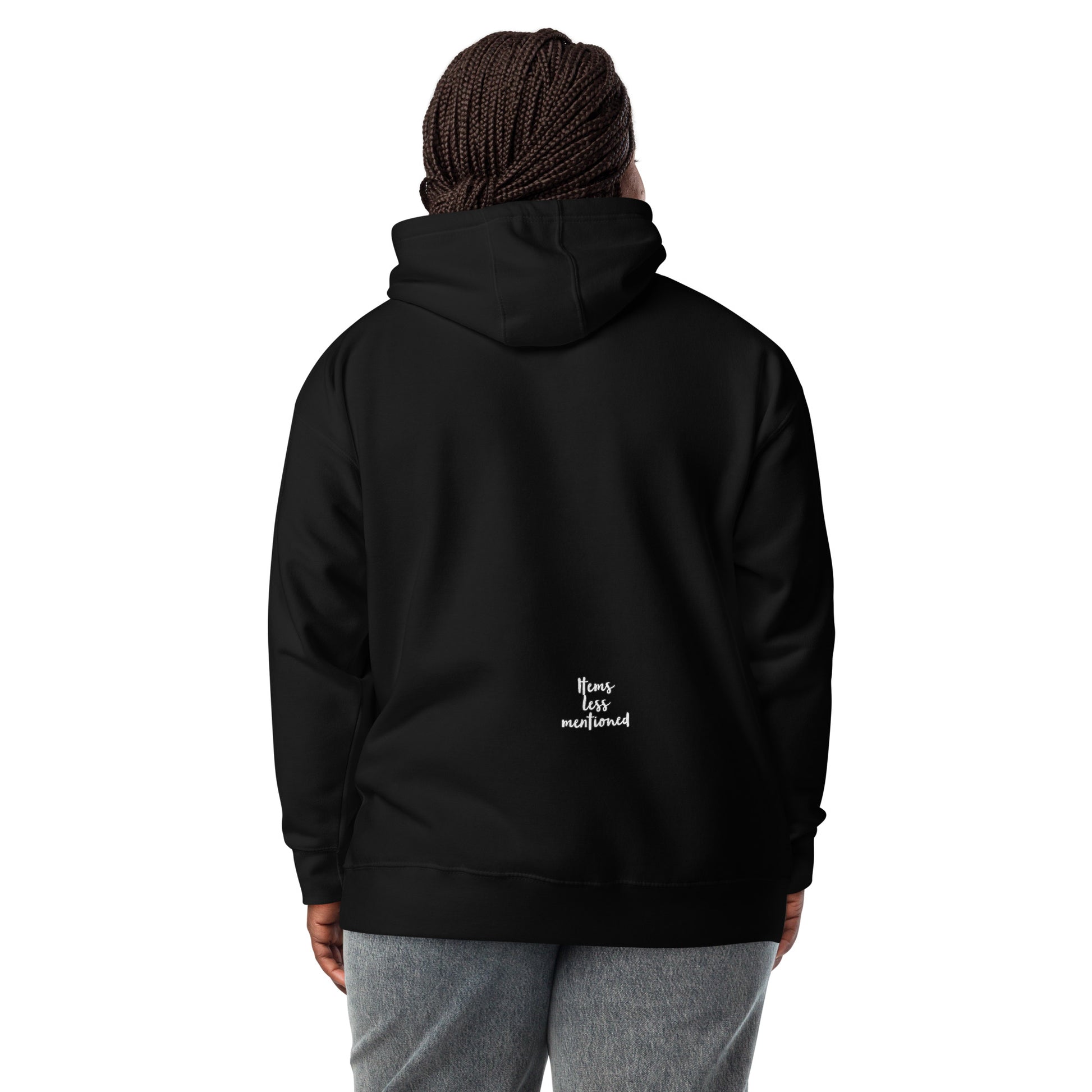Person wearing a black Coffee Distressed Teddy Unisex Hoodie shown from the back with a small "Items Less Mentioned" logo near the bottom, paired with gray pants.