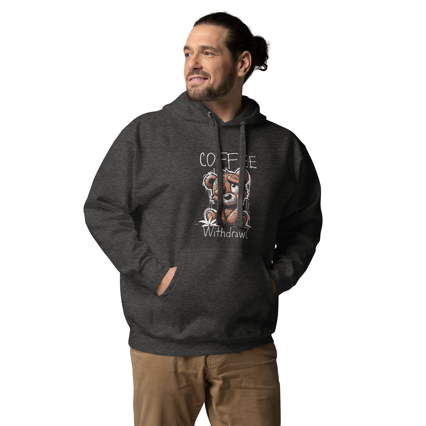 Man wearing a charcoal gray Coffee Distressed Teddy Unisex Hoodie with a distressed teddy bear graphic and the phrase "Coffee Withdrawal," paired with brown pants.
