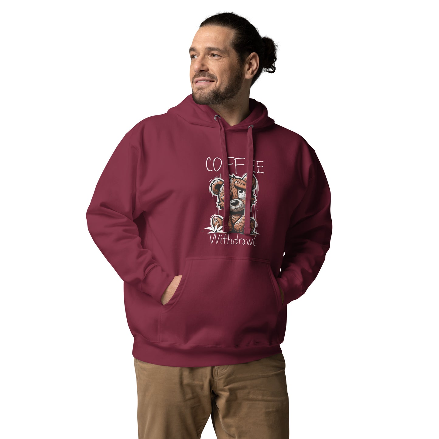 Man wearing a maroon Coffee Distressed Teddy Unisex Hoodie with a graphic of a tired teddy bear and the words "Coffee Withdrawal" on the front, paired with khaki pants.