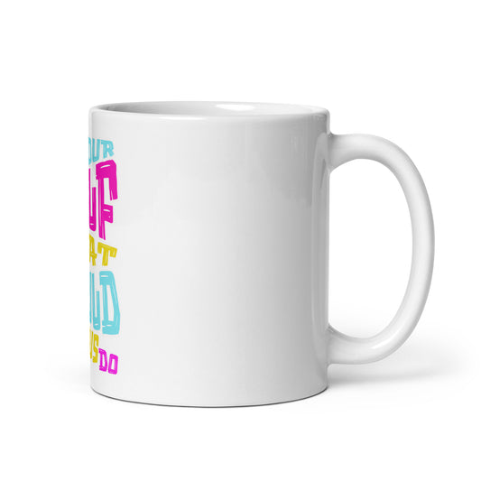 White glossy ceramic mug with handle on the right featuring colorful text design, showcasing the "What Would Jesus Do Mug" faith-inspired Christian gift.