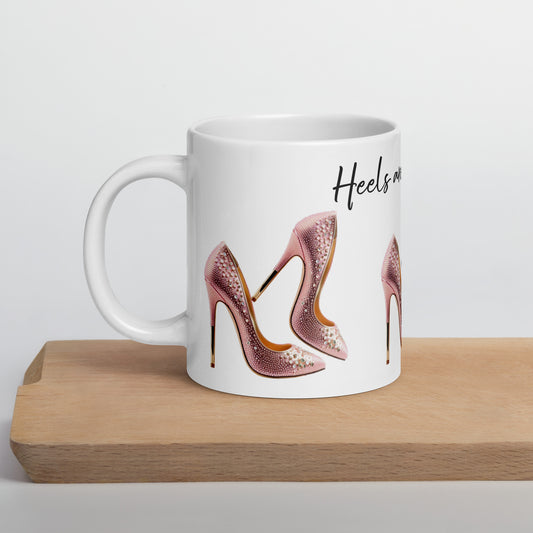 White glossy ceramic mug with an image of pink embellished high heels and the phrase Mug – Life's Better in Pink Heels, featuring faith-inspired, purpose-driven messaging.