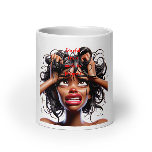 White glossy ceramic Mug – Work in Progress featuring an expressive illustration of a woman with melanin-rich skin, tangled hair, and the text "Careful, I’m a work in progress" in red, embodying purpose-driven messaging and faith-inspired design.
