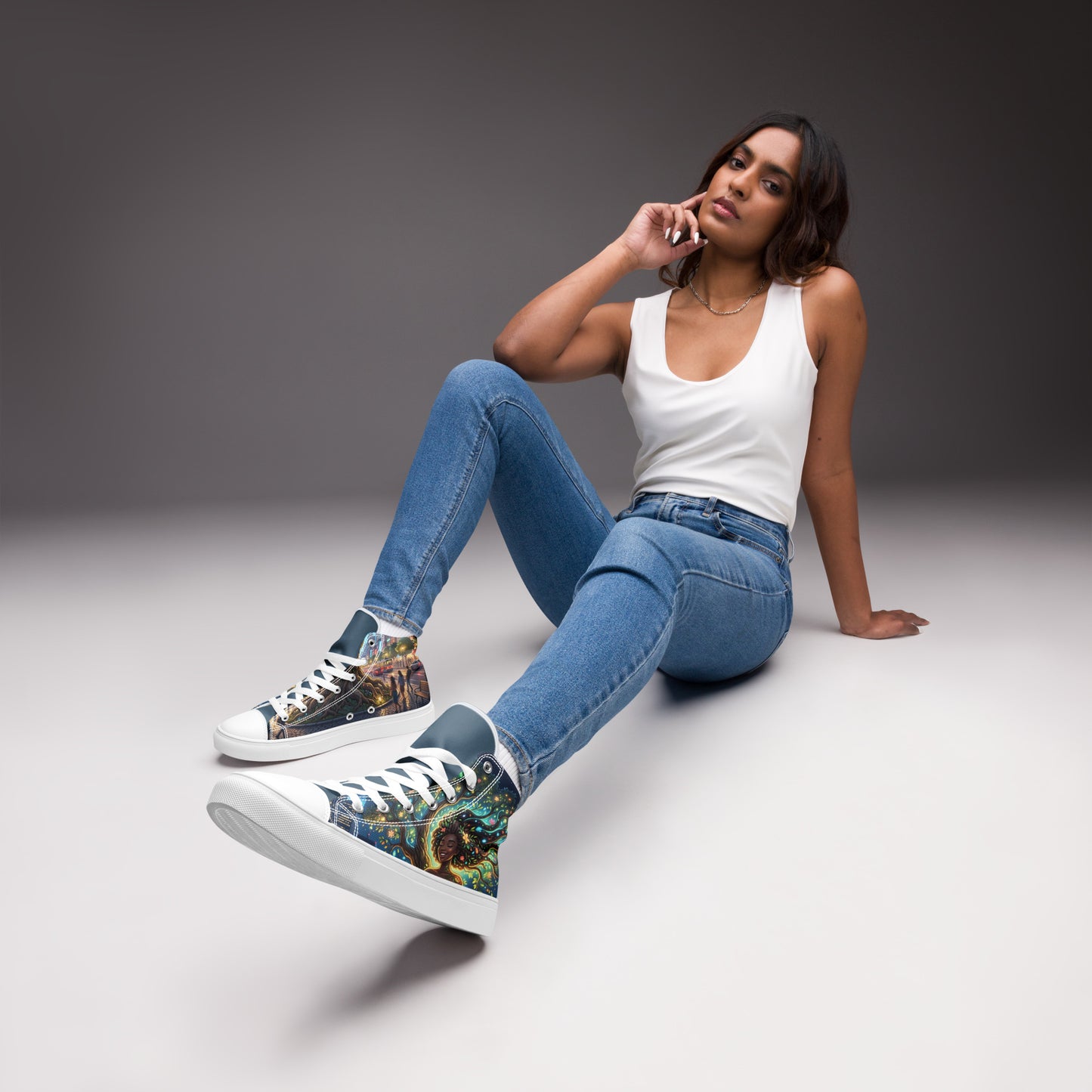Woman wearing patterned high top canvas shoes in vibrant colors paired with casual jeans and white tank top, showcasing Women's High Top Canvas Shoes – Urban Roots.