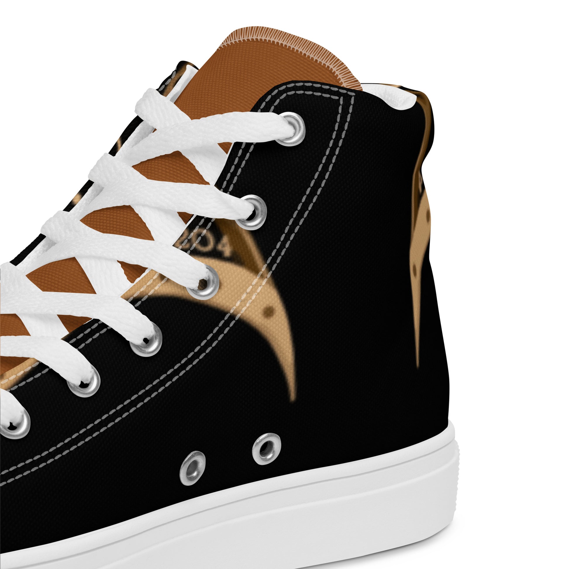 Close-up of a black and brown canvas sneaker with white laces and sole, featuring a stylish pattern, part of the Women's High Top Sneakers – Melanin Queen collection.