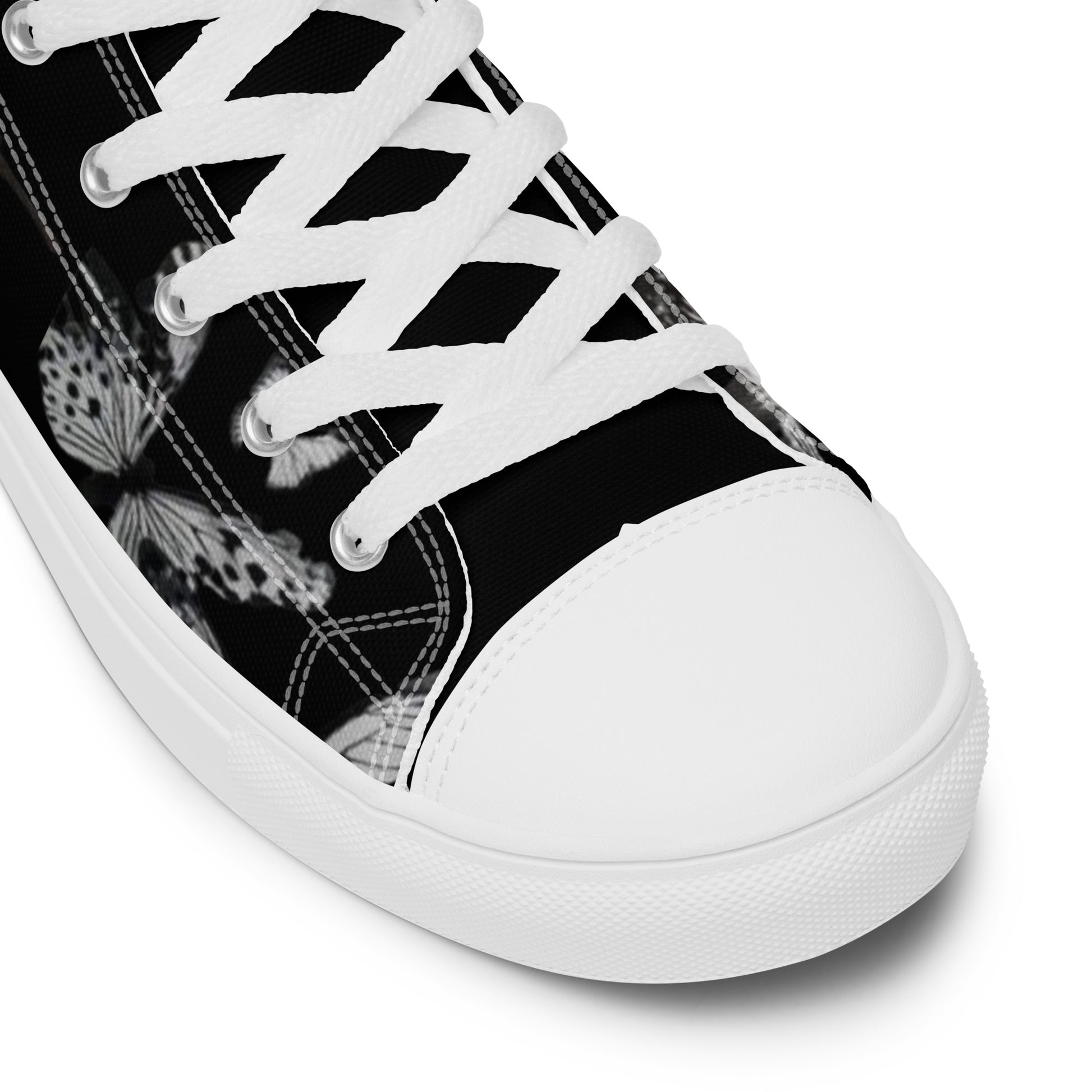 Close-up view of Women's High Top Sneakers – Butterfly in black with white laces and a butterfly print, featuring faith-inspired apparel and purpose-driven messaging.